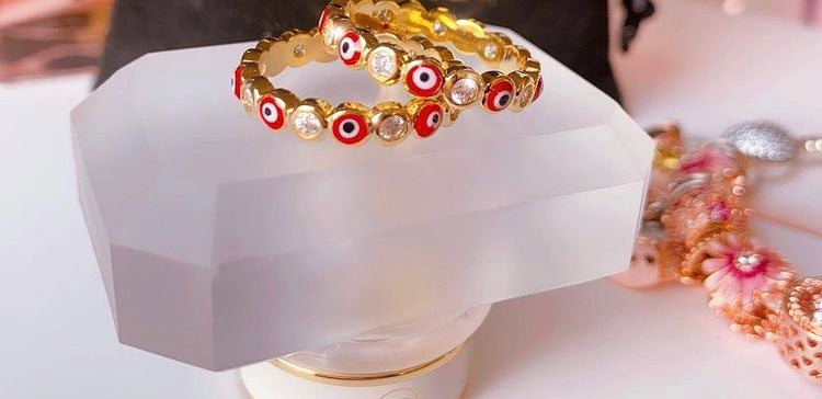 Red all around evil eye ring